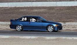 Rick Kull's 99 BMWM3 negotiating through the Temporary bypass at Sear Point w/ Student in car.